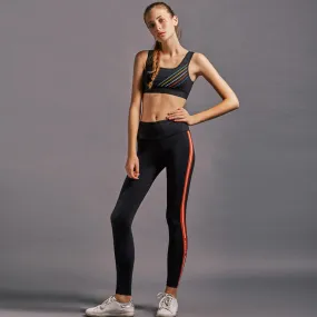 GYMNA RED SIDE STRIPE LEGGINGS IN BLACK
